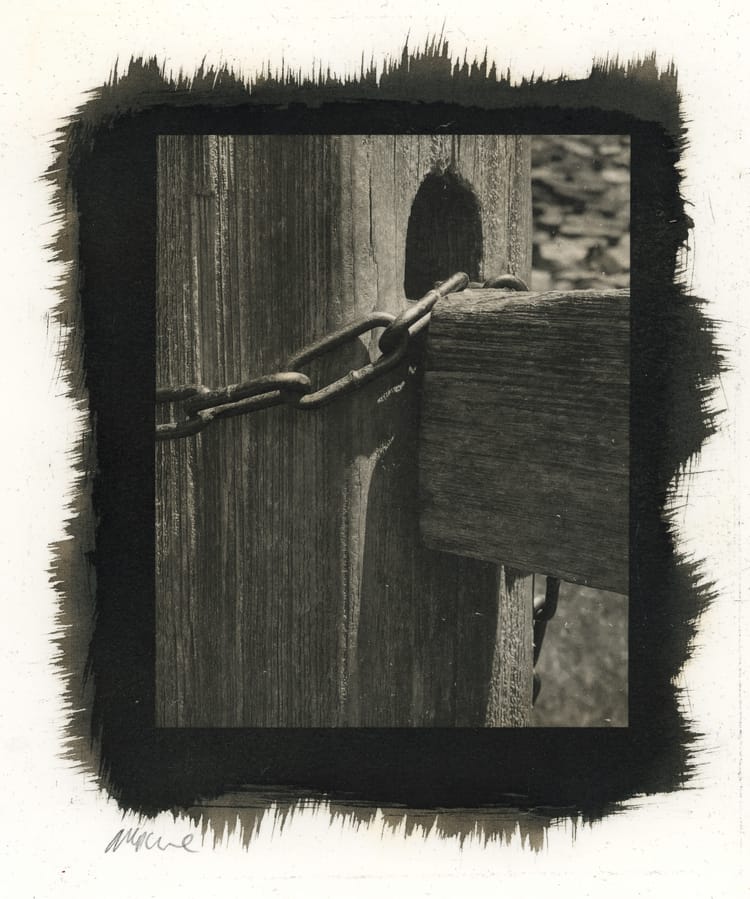 Fencepost and chain