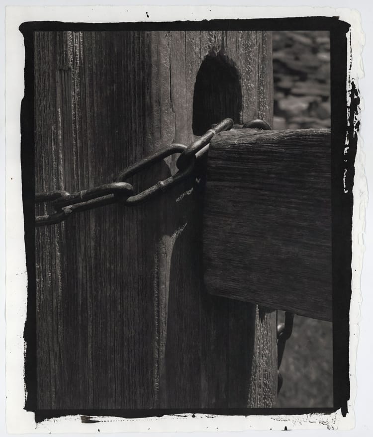 Fencepost and chain